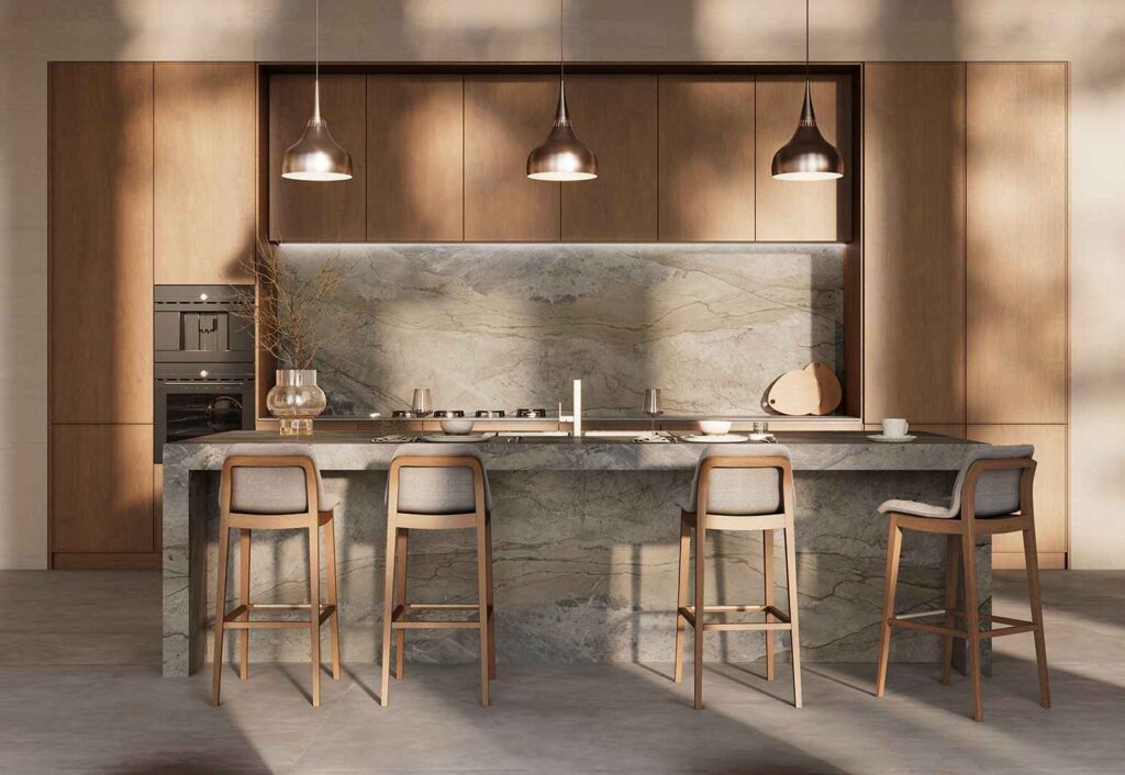 Modern kitchen with a marble island and wooden stools under hanging lights.